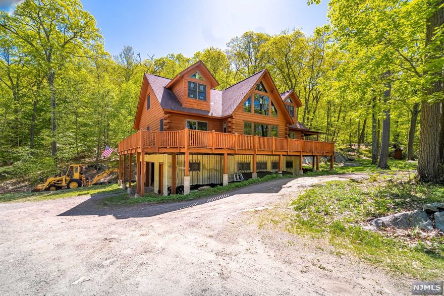 Located in the tranquil heart of West Milford this 4 acres of woodland paradise is ready to transform into your secluded dream home with 1000 feet of land backed up to State Forest. Earthquake R50 value foundation, and a roof rated for a Canadian snow load. This home features high quality Anderson Windows and V Lux Skylights. The gigantic wrap around deck is freshly stained and painted with two access points and a huge bay window. The cabin s logs are 8 inch rather than traditional 6 inch and are Kiln dried, not formaldehyde treated and pre-drilled for future electrical work. There is also tons and tons of building materials to make this your own. Its easy to see that this is a true diamond in the rough with potential limited only to your imagination.