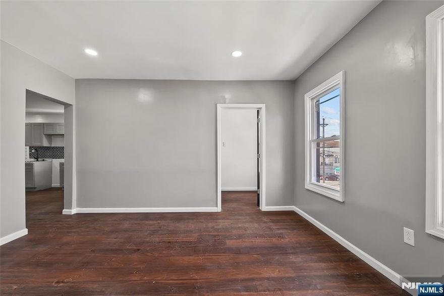 Step inside to discover beautifully renovated spaces, including a modern kitchen and bathrooms that elevate the home's appeal. This 2-family home is in a prime location of Paterson, perfect for investors or owner-occupants. Unit One has 2 bedrooms 1 bath, Unit Two has 4 bedrooms with the finished attic that provides a valuable bonus . Both featuring a brand-new kitchens, updated flooring, modern finishes, and a fresh coat of paint throughout. The home includes a fully finished basement, which offers additional space that meet a variety of needs, whether for storage, a recreational area. Experience the perfect blend of modern amenities and timeless design