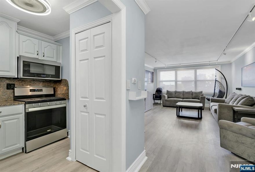 East facing, bright, low floor one bedroom in full service Mediterranean South ! Redesigned kitchen with extra storage/pantry. Bonus entry hall closet for coat storage. Crown molding and LVT flooring throughout. Gut renovated bathroom. Bedroom has large WIC with 2 more in the hallway to the bathroom. Large windows overlooking the outdoor amenities. This unit HAS NO TERRACE. Med South offers 24/7 concierge/doorman, on site mgmt/mtce offices, community room, athletic courts, pools and playground. Gym is available for $15/month per resident. Parking is assigned after closing by mgmt office $95/$85/$75 per month per car. On floor laundry room. Choice of FiOS or Spectrum for cable. Close to free shuttle for Columbia employees. Near to restaurants, houses of worship and downtown area with shopping and restaurants. Easy commute into NYC via NJ Transit or GWB. 4P holds more than you would think and the monthly HOA is LOW ! Come take a look !