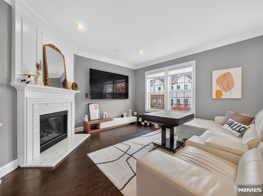 Available to move from Jan 15th. Welcome to this spectacular, classy, and chic colonial townhome offering almost 2,000 sq. ft., 4 bedrooms, and 2.5 bathrooms in one of the most prestigious communities of Central Bergen County. Experience a convenient lifestyle with every amenity just 10 15 minutes away on-site train station, NJ Transit access, community parks, playgrounds, tennis courts, and sports fields. This stunning home features hardwood floors throughout, a cozy fireplace, an impressive open layout, a spacious kitchen, and an outdoor deck truly a one-of-a-kind home ready for its first renters. 2 Car Garage + 2 Car Driveway= total 4 car parking. Tenants pay 1 months of realtor fee and 1.5 months of refundable security deposit. Renters insurance required. 1 dog conditional. No cats allowed. In close proximity to Catherine Doyle Elementary School, residents enjoy access to a large athletic complex, tennis courts, playgrounds, jogging track, dog park, fountain park, and a welcoming front courtyard with benches & lounge seating, along with an on-site coffee & wine shop ideal for those seeking an upscale & convenient lifestyle.