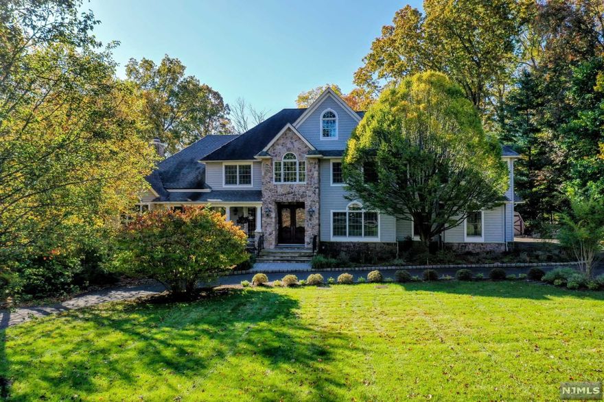 Spectacular newly renovated, move-in ready Architect's home on .96 acres w/ expansive windows, all day natural sunlight at end of private cul-de-sac. 3 luxury living levels & lg backyard ideal for pool. Open flr plan w/ granite, tile & hardwood floors t/o. 2-story granite foyer. Gourmet eat-in kitchen, large island w/ 2nd sink & addl seating. Family rm w/ gas fpl & built-in flat screen w/ surround sound. Great Rm w/ wall of windows, lg stone dual fuel fpl & full featured wet bar, window seats & "cigar" porch perfect for entertaining. Dining rm, 2 half baths, Mud rm & Office complete first flr. 2nd flr Primary Suite w/ sit rm w/ gas fpl, marble bath w/ lg Jacuzzi, oversized shower. 4 addl bedrooms & 2 full shared baths. Lndry rm w/ utility sink. Lower level walk out w/lots of natural sunlight ideal for entertainment w/ Br, Full Bth, Kit, Lndry, Huge Rec Rm w/Theatre, Wine Rm & Exercise Rm. 2 level dk, 3.5 car 1,000 sf garage, circl belgium drive, approx.5,600 2 levs & 2,400 lower