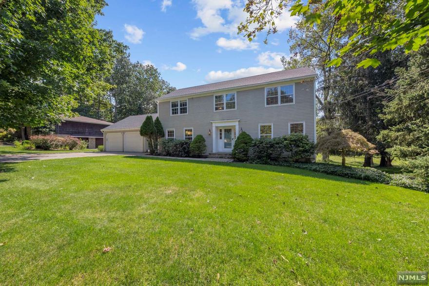 First time offered! 3200 sqft of Classic Colonial with a modern open concept updated and expanded with exquisite design. The property is 0.35 acre with a large back yard. Large living room with windows all around leading to a cozy family room with fireplace. The dining room is right across from a wonderful kitchen with huge island and lots of storage that is drenched with bright natural light. 2-car heated garage, mudroom, powder room and office complete the first floor. The second floor features Master bedroom with walk-in closets, updated bathroom, Laundry, 3 additional bedrooms and full bath. The basement has a bedroom, full bathroom, recreation area and walk out access to the yard. In close proximity to new downtown area, Ruckman Park, Closter Nature Center, schools,