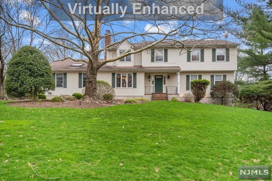 Classic 4/5 bedroom colonial in beautiful West Hill Estates! Entry foyer welcomes you to a formal living room with French doors, banquet sized dining room, eat-in kitchen with granite counters and dual brick wood burning fireplace opens to a GORGEOUS great room with exposed beams, skylight and cathedral ceiling. Office/possible 5th bedroom, the perfect work from home space! Sliders to a backyard paradise with large deck and in-ground fenced-in heated pool;the perfect oasis to relax and entertain! Powder room, large mudroom area, laundry room and entry to a 2 car garage complete the first level. The second floor features a primary suite with a walk-in closet, primary full bathroom, 3 additional nice-sized bedrooms with great closet space and a full bathroom. Immense unfinished lower level with tons of storage space. All this in fabulous Ramsey with great schools, parks, fantastic commuting options to NYC and vibrant downtown with gourmet dining and shopping. A must see home!