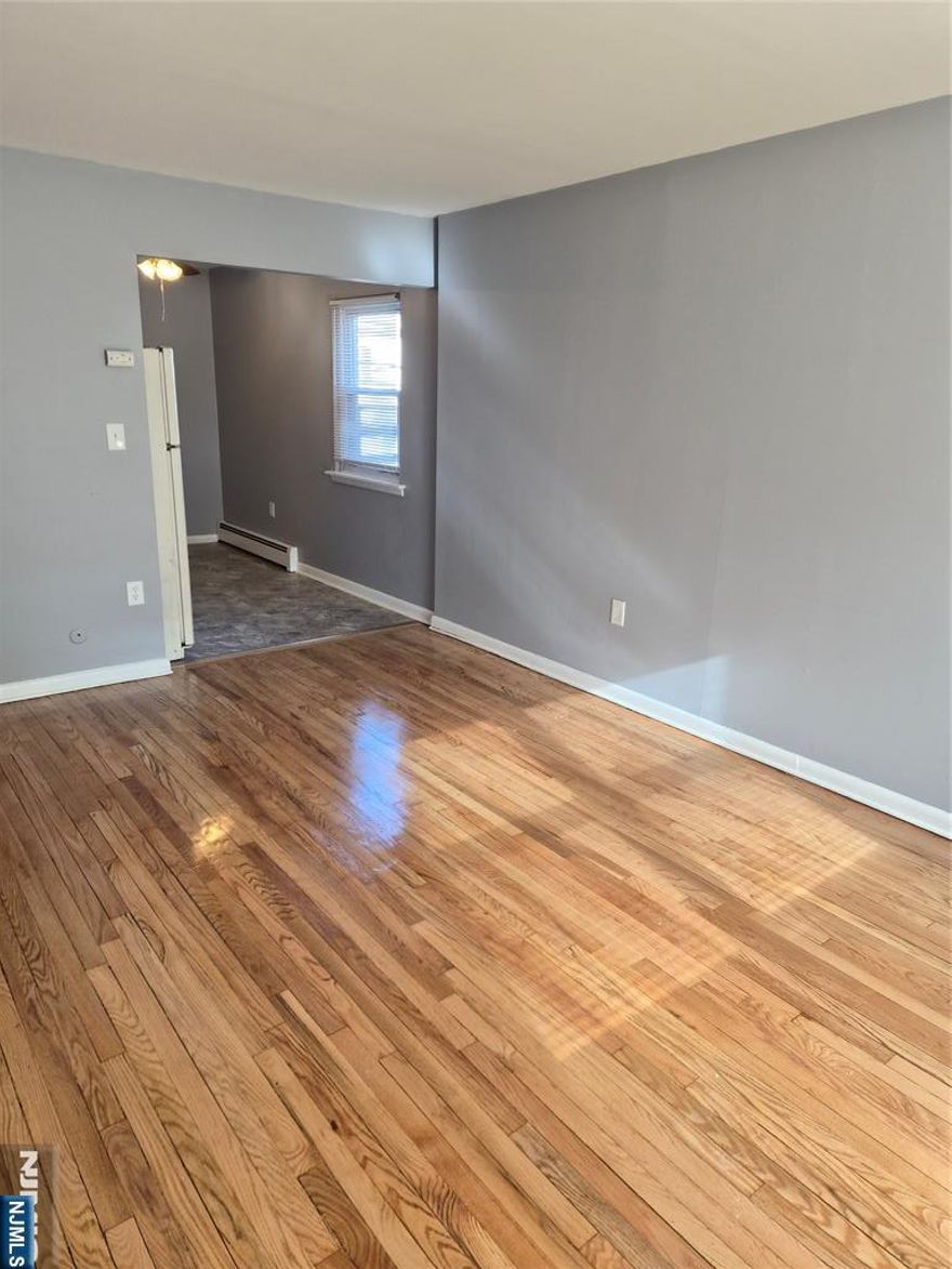 2nd Floor Large Studio Apartment - Living Room, Kitchen & Bath. Freshly Painted, hardwood flooring. Refrigerator included. Heat, gas and electric and parking all included. Close to stores and transportation.