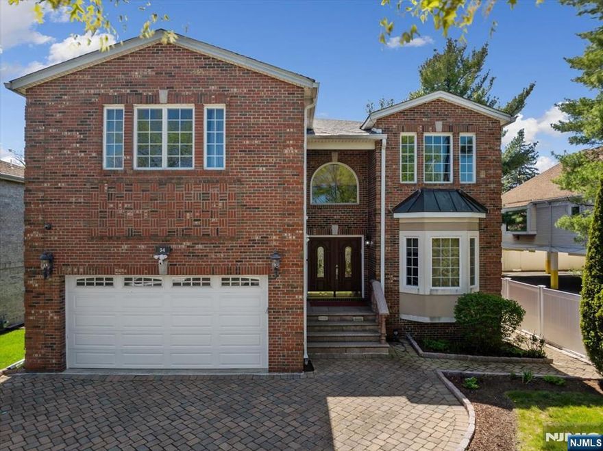 Custom Built Gem in the sought after Englewood Cliffs. A spacious and well-appointed single-family home built in 2004. This residence offers approximately 5,000 square feet of living space including basement. The home boasts of a modern, open-concept layout with abundant natural light. Key features include new snow melting roof, California closets, gourmet kitchen, huge paver patio. A walk out basement with a full bath and easy to finish. The home is located at a high elevation at the end of the street of fourteen homes built at the same time and has a closed gate to make it a small community. Low taxes and excellent schools make Englewood Cliffs a very desirable place to be called home.