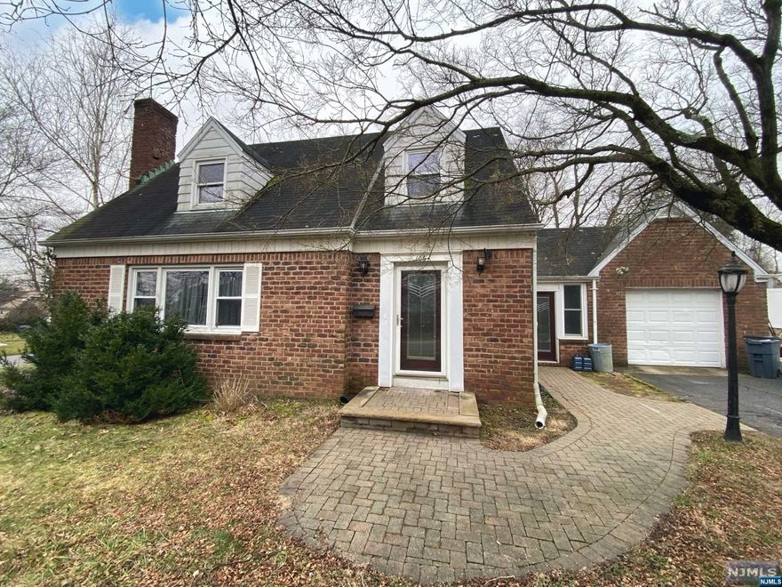 Charming brick home with hardwood floors throughout and large property in Northvale! Large living room with a stone fireplace, open to the dining room. Spacious eat-in kitchen with access to the sunroom. Half bath completes the first level. The second level offers three large bedrooms and an updated full bath. The large, lush property is great for entertaining. Attached garage! This home can also be used for mixed use. Have a business, and live here. Signage can be put on lawn. Located in the main center of Northvale, close to shopping, transportation, and short distance to all amenities. Great schools, and Northern Valley Old Tappan High School. Great opportunity!