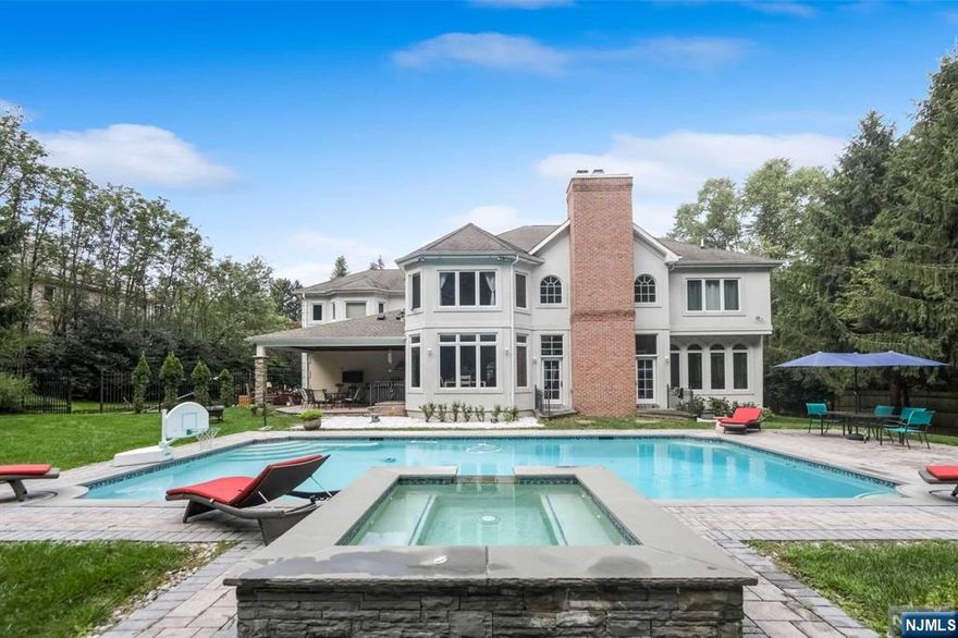 Presetted by The Rapapaport Group-Tami Rapaport 201.665.5558 Nestled in a desirable East Hill cul-de-sac,ona 23087 SF lot, this exquisite stucco home offers approximately 4,500 sq. ft. of luxury. Enter through a grand two-story entryway featuring a curved oak staircase. The spacious great room with a fireplace, along with beveled glass French doors, leads to brick and slate patios. A sunlit conservatory enhances the ambiance. The stunning kitchen and dining area overlook beautifully landscaped grounds, complete with custom cabinetry, granite countertops, a butcher block island, and top-of-the-line stainless steel appliances. The second floor features a luxurious master suite with double doors, a tray ceiling, a dressing alcove, and a spa-like bathroom. Enjoy hardwood floors, Pella windows, Genarator, a three-car garage, and a stunning backdrop of lush greenery from Green Acres Preserve. This home combines elegance with modern comfort, creating a truly enchanting atmosphere.