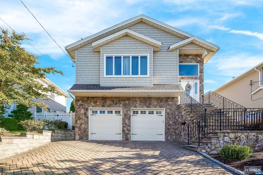 Custom home in amazing location, only 9 years young. Spacious with open floor concept, and hardwood flooring throughout 1st and 2nd level. Beautifully maintained. On ground level, custom built in wet bar, wine chiller, granite countertops, sliding glass doors to paved patio, and 4th bedroom or home office perfect for entertaining or extended family. The basement is framed and has rough plumbing, ready to go, just add flooring. Walking distance to Woodland Park and 5 blocks to amazing schools.