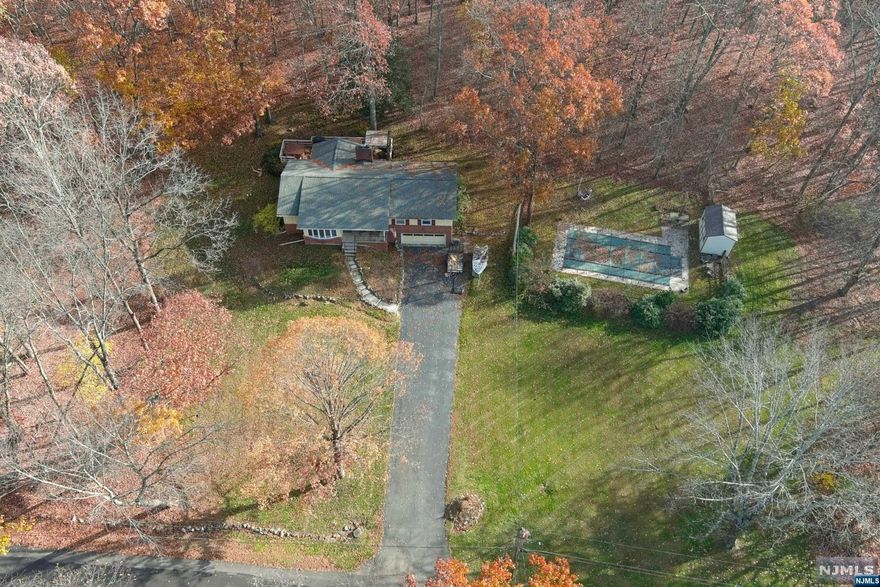 Enjoy Kemah Lake at this awesome Ranch home on 2+ acres with In-ground pool, deck with hot tub, huge open front yard and front porch with sunset and seasonal lake views! Step inside to the open floor plan with the formal Living Room and wood stove, Family Room with fireplace, spacious Kitchen with Breakfast Bar and bright Sunroom/Dining Room. Additional features of the main level are 3 Bedrooms including Main Bedroom with full bath, Main Bathroom, half bath and Laundry Room with tons of cabinet space and storage closet. Step down to the finished basement where you can enjoy the huge Rec Room and Bar. There are storage closets plus heated workshop and walkout to the 2 car garage. Spend hot, sunny days by the pool or at the lake beach and cool nights in the hot tub. No matter what time of year, there is plenty to do here, all year long! Room sizes approximate. Lot size per tax record.