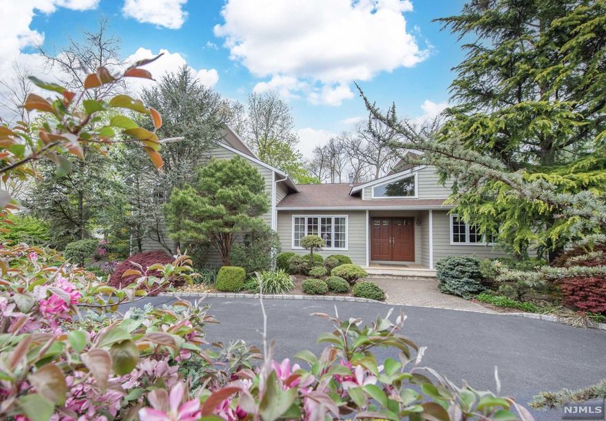 Prestigious RIKER HILL Perfect Layout CONTEMPORARY on .6 LUSH POOLABLE acres. Over 5500 sq ft incl finished basement. BRIGHT Foyer is welcoming with HIGH CEILINGS and tons of NATURAL LIGHT. A 600+ sq ft GREAT ROOM spills out to a LARGE AZEK Maintenance-free deck overlooking LEVEL FENCED-IN yard. Main Level LIBRARY/Office w/Gas Fireplace, Butlers Pantry w/proper built-ins and Wet Bar. Large EAT IN Kitchen with Center Island, WALK-IN Pantry, SS appliances and Plenty of Windows. A few steps up are 4 Bedrooms and 3 Full Baths incl. Master Suite with SPA LIKE renovated bathroom. A few steps down is a Large Family room with WALK-OUT to the Backyard, Bedroom #5, Full Bathroom & Laundry. A few steps down FULL FINISHED 700+ sq ft Basement including rec room, Bonus room/ Bedroom #6 and plenty of storage. This home goes on and on! Short Stroll to Top Rated Riker Hill elementary school, NYC Bus stop, Starbucks and Aldi. THIS IS THE COMPLETE PACKAGE YOU HAVE BEEN WAITING FOR!