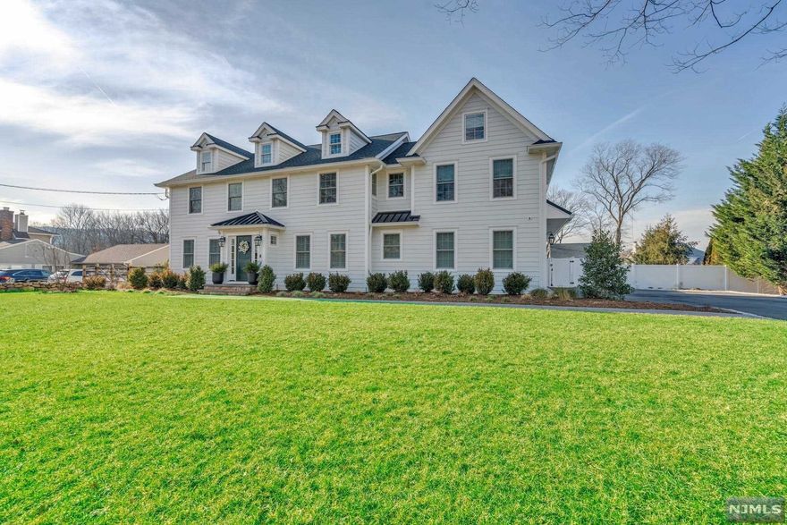 This stunning New England style C/H Colonial home was remodelled in 2021 and is located on one of the most desirable streets in Wyckoff. The 1st floor is filled with custom cabinetry and millwork, mudroom, 1/2 bath, home office, walk-in pantry, formal d/r w/built in's, and large vaulted ceiling family room. The kitchen features top of the line appliances, w/marble countertops and center island. Off of the kitchen is a spacious screened porch overlooking a large flat backyard. The 2nd floor features 2 bedrooms w/Jack and Jill bathroom, 1 en-suite and a laundry room w/storage. The owners suite has a spa like bathroom with heated floors, luxurious soaking tub, and his and her walk-in closets. The basement has 10' ceilings, w/small office/den. The backyard is right out of the Hamptons with a heated salt water pool, 1 1/2 story finished cabana with small kitchen and 1/2 bath. Custom built outdoor kitchen, whole house generator, and your own turf putting green and so much more.