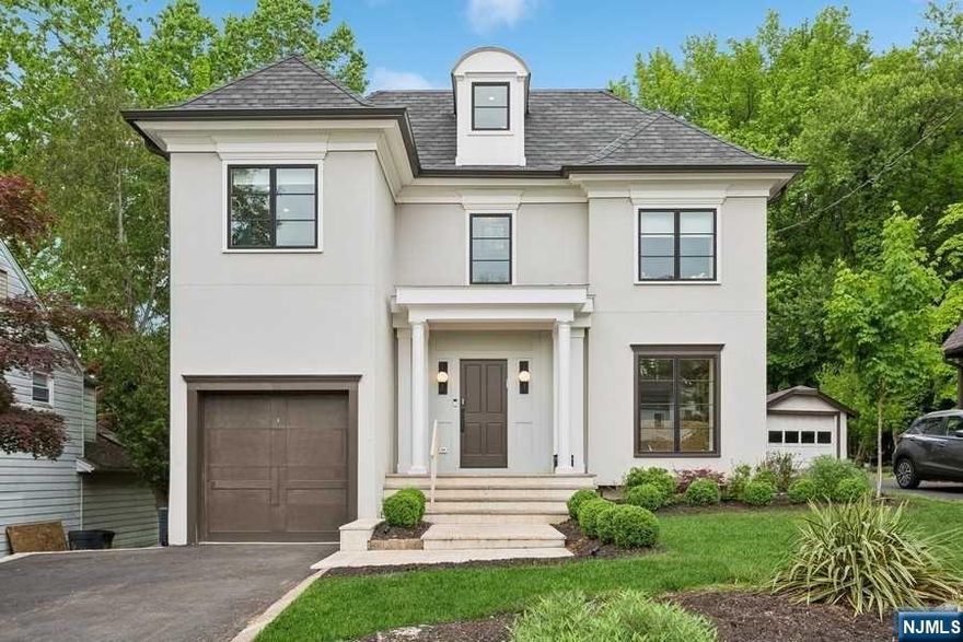 Beautiful, bright and spacious home in the West Englewood neighborhood of Teaneck. The first floor includes an open living room open to formal dining room, large modern eat-in kitchen with high-end double appliances with separate eating area which opens to a family room. Also the first floor has a mud room and walk-in coat closet and 1/2 bath. The second floor boasts the primary suite with a walk in closet and oversized bathroom with separate shower and soaking tub. Spacious 4 additional bedrooms and 2 full bathrooms. The third floor has a recreation area, office and large balcony overlooking Tkoloka Park nature land. The basement includes a guest room, full bath, laundry room, recreation area. Crown molding, rift and quartered white oak on first and second floors, 2 zone HVAC and custom closets throughout the house. Close to parks, houses of worship and transportation.