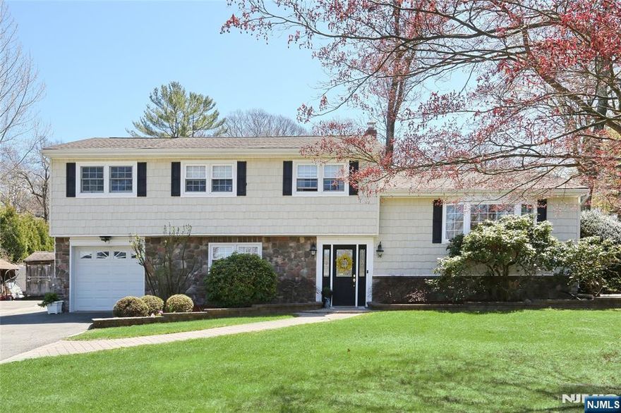 Welcome to this move-in-ready home in Oaklandâ€™s sought-after Dogwood Section! Featuring 3 bedrooms (functions as 4), 2 full baths, and great flow throughout, this home offers comfort and style. Enjoy a bright, open kitchen, formal dining room with patio access, formal living room, and family room with woodburning stove and sliders to a lower patio. Gleaming hardwood floors, central A/C, one-car attached garage, oversized driveway, and two storage sheds add to the appeal. The spacious yard sits on a quiet, interior street in a friendly community known for top-notch schools, direct NYC transportation, abundant greenspace, a dog park, and great restaurants and shopping. Brand-new septic being installed!