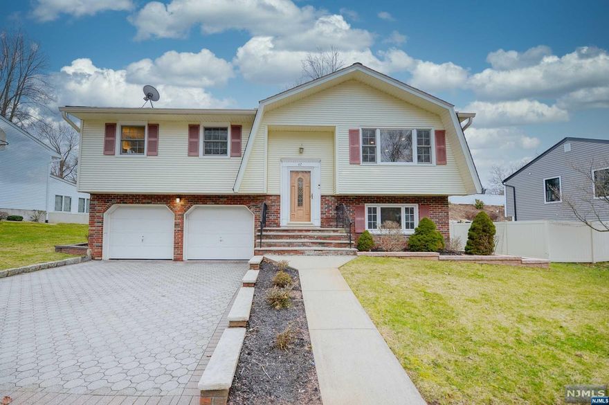 Welcome to your charming oasis in Westwood! Step into this pristinely kept bi-level home and prepare to be enchanted by its warmth and coziness. As you enter the ground level, you're greeted by a cozy family room adorned with a sliding glass door that invites you to step out onto the huge and meticulously maintained yard and patio. A full bathroom offers convenience, while access to the 2-car garage and laundry room, boasting newer washer and dryer, adds practicality to this delightful space. Ascending to the first floor, you'll find yourself in a sunny entry foyer that sets the tone for the rest of the home. The living room exudes comfort, while the formal dining room beckons for gatherings. The modern eat-in kitchen, complete with granite countertops, is a chef's dream. Three ample-sized bedrooms provide sanctuary, and a full bathroom offers relaxation after a long day. Perfectly suited on a quiet tree lined street, right by Pascack Brook County Park offering ample amenities !