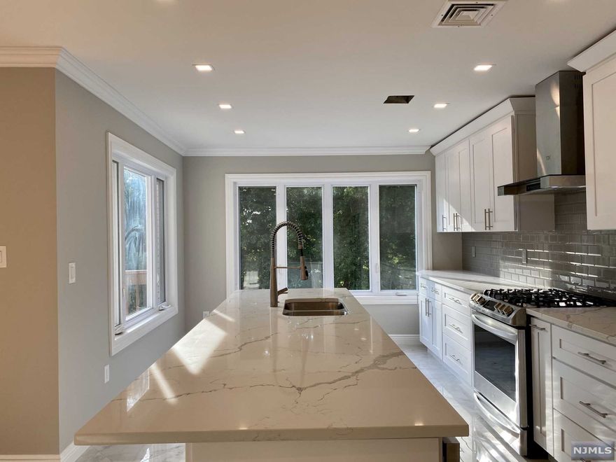 Totally renovated in 2020 oversize Duplex in a highly sought after neighborhood on the northside of Fort Lee on the border of Englewood Cliffs. Total of 5,351 sq.ft. Each side equipped with 4 Large Bedrooms, 3 full baths and 1 half-bath. Sun Frenched living room, sizable eat-in-kitchen, large deck off the dining room. Fully finished basement with full bathroom and separate entrance to the outside/backyard, perfect for a family room or a guest bedroom suite. Hardwood floors throughout, skylights. Attached 2 cars garage on each side. Incredibly spacious fenced backyard. Close to public transportation. Walking distance to Blue-ribbon School #3. Perfect for an investment opportunity, live in one side, rent out the other. Owner is a NJ/NY licensed Real Estate Agent.