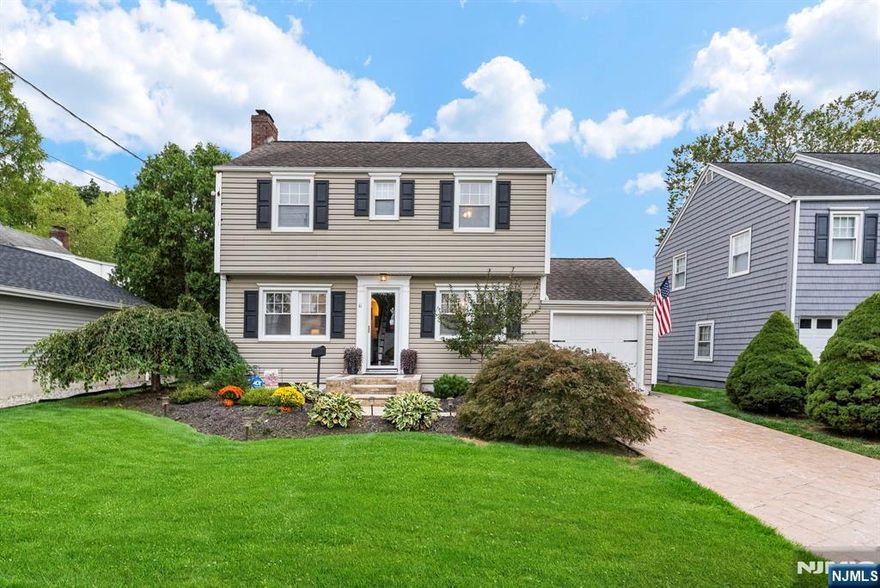 Discover this beautifully updated Center Hall Colonial in Cliftonâ€™s desirable Allwood section, offering the perfect balance of charm and modern comfort. A bright living room with a wood-burning fireplace opens to your formal dining room and updated kitchen with stainless steel appliances. Upstairs youâ€™ll find three bedrooms and a full bath, while the fully finished basement adds incredible living space with a game room, guest area, laundry, and half bath. With central cooling and heating, a backyard made for entertaining, an attached garage, low taxes, and an easy NYC commute. This home truly checks every box for your suburban dream. Schedule a showing before itâ€™s gone!