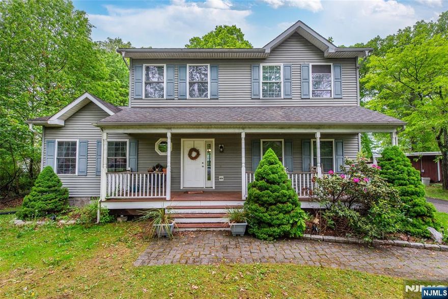 Lovingly maintained and full of charm, this 4-bedroom, 2.5-bath home is nestled on a peaceful street. A classic rocking chair front porch welcomes you into a warm, flexible layout. The main level features a front room that can serve as either a formal living room or dining room, offering versatility to suit your lifestyle. This space flows into a comfortable family room that opens to the kitchen and casual dining area perfect for everyday living and entertaining. Also on the main level are a convenient bedroom, laundry room, and powder room. Upstairs, you'll find three additional bedrooms and two full bathrooms, including a spacious primary suite with a large walk-in closet and a private bath featuring a whirlpool tub and separate stall shower. The large yard offers plenty of room for outdoor enjoyment, gardening, or simply relaxing in a peaceful setting. A wonderful blend of comfort, flexibility, and classic appeal in a quiet neighborhood.