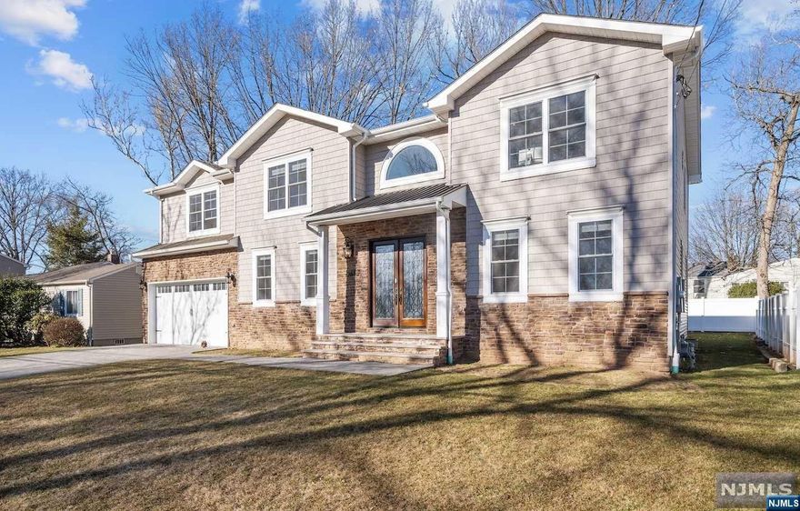 IMMACULATE Center Hall Colonial in the heart of picture-perfect RIVER EDGE! This 5 bedroom, 4 full bathroom home was built in 2019 & sits on a quiet, tree-lined street. 2 story entry foyer greets you upon entry. Classic floor plan w. Formal DR that flanks the foyer. DREAM KITCHEN w. massive center island, quartz countertops, & upgraded appliances. Double Oven, Pot Filler, Micro. in Island! Wet Bar w. Beverage Center & Sink. Kitchen is OPEN-CONCEPT to Fam Room w. Fireplace that looks out to the backyard w. a paver patio. 1st Floor bedroom & 1st Floor FULL bathroom! Spacious Bedrooms on the 2nd level. Great Primary Bedroom that features 2 walk-in-closets & a spa-like primary bathroom w. a soaking tub, double vanity, & glass shower. Jr Suite w. en-suite bathroom & 2 additional bed w. a Jack & Jill bath. Laundry on 2nd level. Finished basement & 2 car garage! New full-house generator. River Edge is home to amazing schools & EASY commuting into NYC! Walking distance to Van Saun Park!