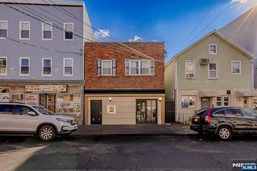 Prime location in the heart of the Ironbound! This versatile mixed-use property features a retail/office storefront on the first floor ideal for a variety of uses such as office, medical, or retail. The second floor includes two apartments, providing great income potential. Excellent opportunity for investors or owner-occupants seeking a live/work setup. Conveniently located near major highways, transportation, shopping, and restaurants.