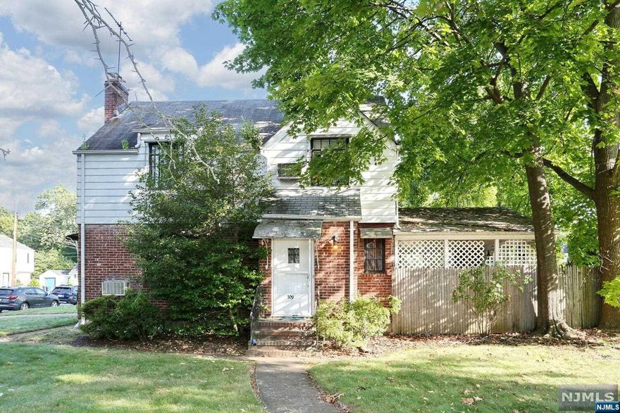 Classic custom built brick front colonial! Entry foyer opens to huge spacious living room with fireplace and built in cabinetry. Gorgeous wood trim and door throughout. Formal dining room. Kitchen opens to large and unique covered brick porch with built in grill. Upstairs three good size bedrooms, bath with shower stall & separate tub. Basement is unfinished with convenient half bath. Walk up attic storage. New gas heat. One car garage. Large private yard. A must see to appreciate this stately colonial!
