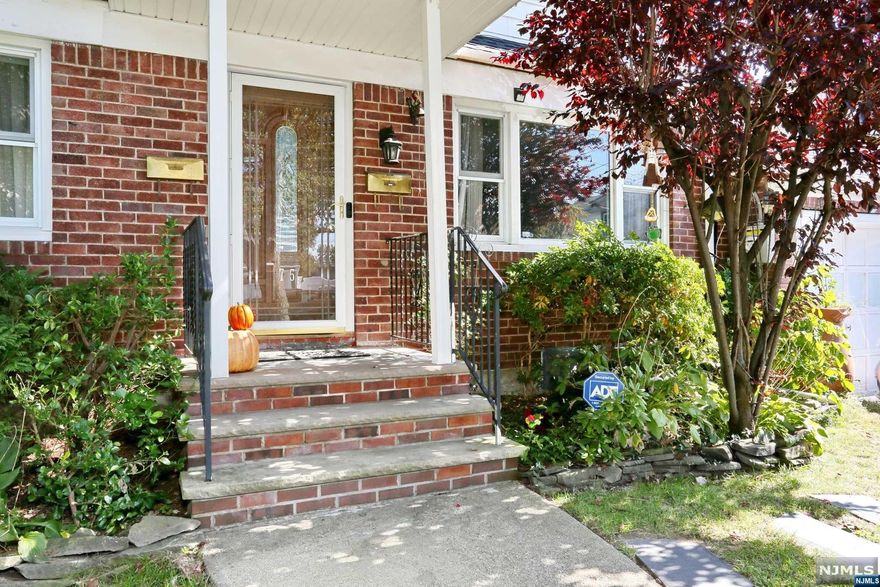 Welcome to a charming and spacious 2 family home located in Dumont on a corner lot near the New Milford Border. First floor apartment features a living room, eat in kitchen, two bedrooms and bathroom. You will also find access to a large basement with tons of potential to finish. Second floor unit features living room, eat in kitchen, two bedrooms and bathroom. This home has an attached garage and two separate driveways, one on Lawrence Ave and one on Moore Ave. A backyard oasis containing a pond with koi fish complete the home. Home will be delivered vacant. This is an as is sale. There are no known issues.