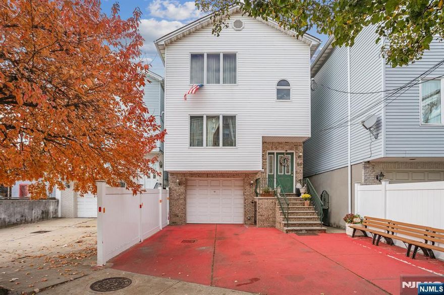 Welcome!!! TO THIS RARE OPPORTUNITY TO OWN!!! A newer, well-maintained, large, two-family home conveniently located in the sought-after Ironbound section. Everything is just steps from your door. Ironbound Restaurants/Ferry Street Shopping Stores / Nightlife, and local recreational Parks, while close to all major public transportation, Newark Penn Station with an "EASY NYC COMMUTE Features: Both Apartments Open Floor Plan concept, kitchen, living & dining room, three bedrooms, two full baths, hardwood floors throughout. The laundry room is at ground level for both units. The recreation room has a full bath and tiled flooring. Exterior Brick front and vinyl siding and rear deck connecting to the back yard, Built-in garage, driveway for two cars, Spacious Back Yard, Central HVAC for both units, * Great for the first-time homebuyer or investor