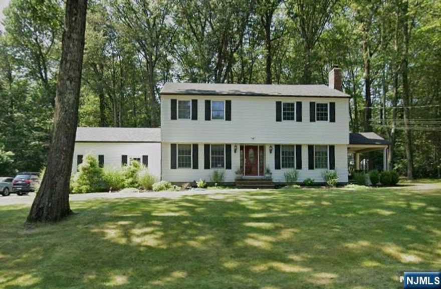 Nestled in one of Woodcliff Lake's most coveted and serene neighborhoods, this Colonial presents a rare opportunity to own nearly 3/4 of an acre of Bergen County prime real estate on the hill. The home features 4 bedrooms, with the possibility of a 5th, and 1.5 baths, alongside a finished basement and a 2-car attached garage. Significant updates include a new roof, whole house generator, central air, and a new hot water heater, offering great peace of mind. With endless potential, this house needs a little TLC to be brought to its full glory. Enjoy the convenience of being near transportation, shopping, schools, parks, and houses of worship.