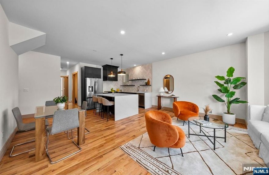 Welcome to 221 Clerk Street, a beautifully renovated, custom-designed high-ceiling duplex condo offering exceptional space, versatility, and style in the heart of Bergen-Lafayette. This spacious home features 4 generously sized bedrooms and an airy open-concept kitchen and living area, designed for both everyday comfort and effortless entertaining. The main level includes a serene primary suite with a private en-suite bath, while the lower level offers a second primary suite complete with a full bathroom, flexible living space, and direct walk-out access to the backyard or private entryway. The lower levelâ€™s layout allows for endless possibilitiesâ€”ideal as an in-law or mother-daughter suite, guest quarters, home office, or income-generating space. Thoughtful design, abundant storage, and smart separation of space make this home as functional as it is beautiful. Situated in an unbeatable Bergen-Lafayette location, youâ€™re moments from the Light Rail, Berry Lane Park, neighborhood coffeehouses, shops, and diningâ€”offering the perfect blend of urban convenience and community charm. A rare opportunity to own a turn-key, multi-functional duplex condo in one of Jersey Cityâ€™s most dynamic and rapidly growing neighborhoods.