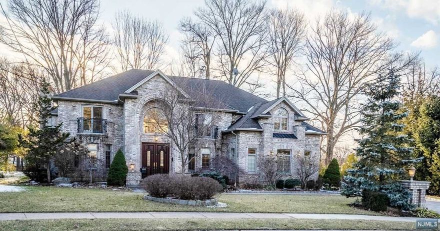 Charming Brick Colonial with unique architectural designed foyer, gourmet kitchen. and breakfast room with radiant heat floor, family room w/fireplace, guest room with full bath, Master Suite with seating room and fireplace, 2 bedrooms with J&J bath, finished basement with BR and full bath, media room, luxurious interior finishes, including trim moldings, marble floors. lighting fixtures and top appliances, Enjoy the beautiful backyard for barbecues and fun get-togethers A Must See...