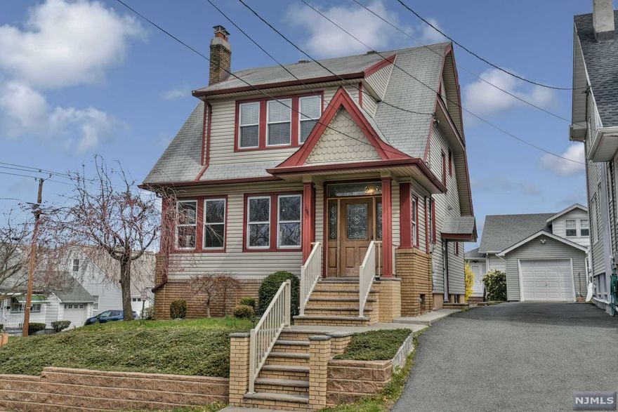 WELCOME HOME! This beautifully updated and well maintained side-hall colonial is the perfect combination of old and new. Original moldings, gleaming hardwood floors, and a touch of stained glass window details are just some of the charming characteristics that greet you as you walk through the door. Enter into an expanded foyer that leads you to a oversized family room with custom built-ins & wood burning fireplace. A generously sized dining room and updated kitchen complete with a wine fridge and original backsplash details, makes for a perfect layout. Upstairs features a full bath and 3 good sized bedrooms with plenty of closet space in each! The walk up attic and full unfinished basement provides a ton of potential for expansion possibilities! This corner lot property equipped with a large paver patio will have you ready to call this house home!