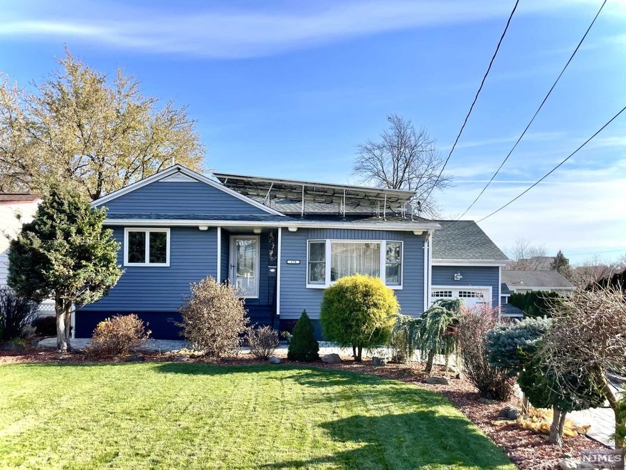 Tastefully renovated home on a dead end street!!! The first floor consists of a living room and dining room, three bedrooms and a full bath, with hardwood floors throughout, built in cedar closets, and central air. The kitchen has new stainless steel appliances and granite countertops, as well as heated floors. The full walk out basement is finished with a family room, full bathroom, and a sunroom that has an outside entrance to patio. The roof is 10 years old and the water heater is 2 years old. The solar panels were installed in 2009 and are fully paid for.