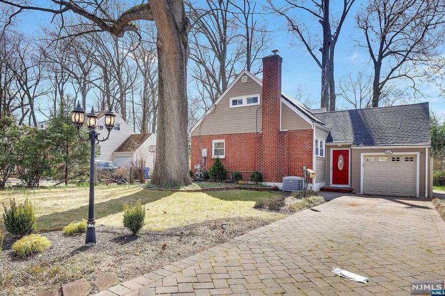 Welcome to this beautifully renovated 4 Bed, 2 bath home in the highly desirable Manor section of Englewood. Situated on a quite tree-aligned street, this stunning home has been thoughtfully redesigned and updated to offer modern living in a classic setting. Upon entry, you're greeted by a welcoming entry foyer followed by a spacious open plan living and dining area that boasts hardwood floors, an abundance of natural light and a wood-burning fire place - this space is perfect for entertaining guests. The modern kitchen features high-end stainless-steel appliances including a refrigerator, gas range stove, dishwasher, wine fridge, quartz countertops, and custom cabinetry, making it a dream for anyone who loves to cook. The main level of the home also features 2 Bedrooms, den and a spa-like bathroom. On the second level there are 2 more spacious bedrooms and main bathroom features custom tiles and glass enclosed rainfall shower. Schedule your private tour today to see this beauty.