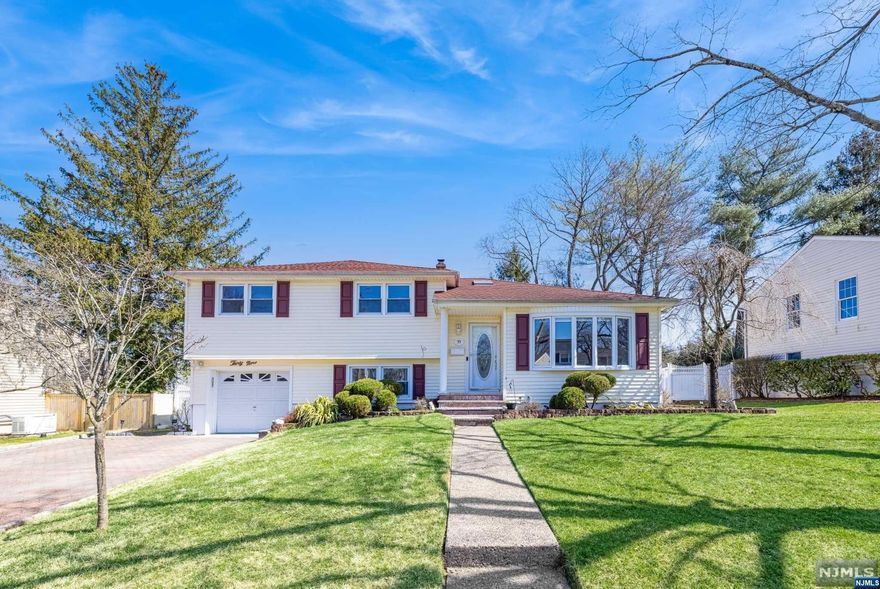 Welcome to this meticulously maintained, extended Split level home! Inside, find a spacious living room with a beautiful bow window, perfect for gatherings. The upgraded granite kitchen is the heart of the home, featuring a cozy breakfast area and sliding glass doors to your outdoor oasis. Enjoy cozy evenings in the family room. Downstairs, discover a versatile den or office space, a full bath, and a convenient laundry room. The lower level boasts a finished rec room with a bar area for entertainment. Upstairs, retreat to the primary bedroom with its own full bath, along with two additional bedrooms and another full bath. This home offers gleaming hardwood floors. Outside, the covered patio is perfect for barbecues. With its low maintenance exterior and easy access to NYC transportation, this home has it all. Call today and make it yours!