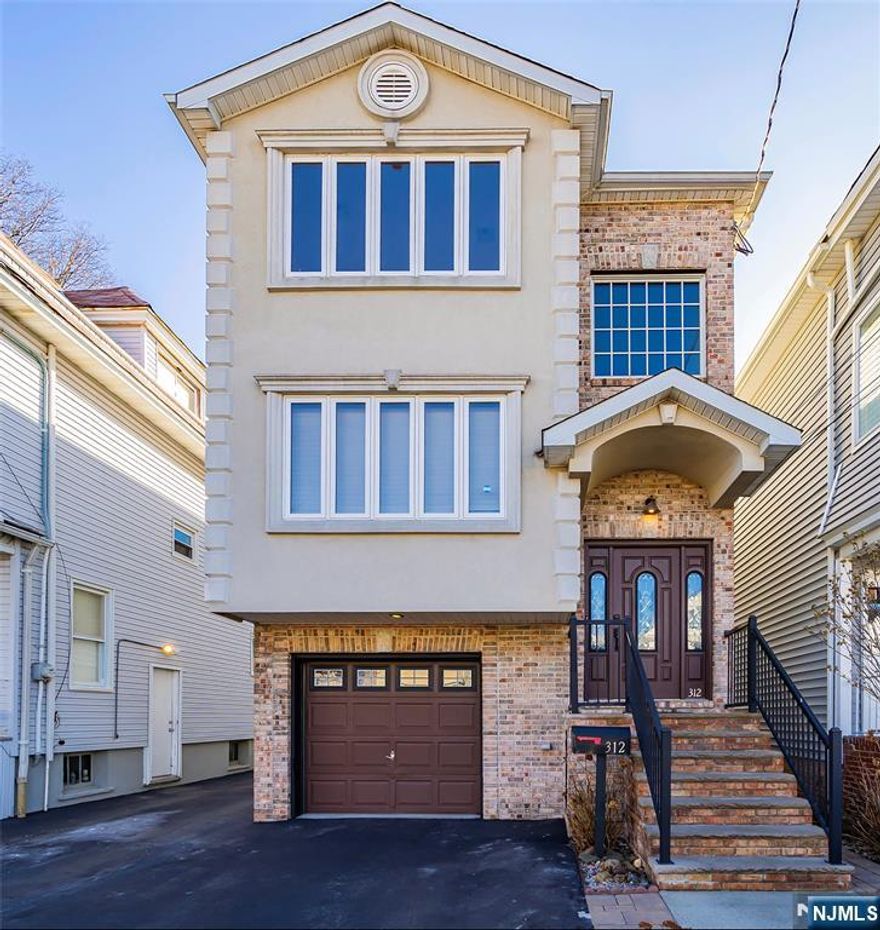 Welcome to this spacious and beautifully designed 1st floor apartment featuring an open-concept layout with three generously sized bedrooms, two bathrooms, and stunning hardwood floors throughout. The master bedroom boasts a large walk-in closet and private en-suite bathroom, while the roomy kitchen offers plenty of cabinet space and convenience with available laundry hookups. Enjoy the comfort of central air and forced hot air in this commuter-friendly location, with easy access to major highways, NJ Transit to New York City, supermarkets, restaurants, and Newark Liberty Airport. One parking space is included.