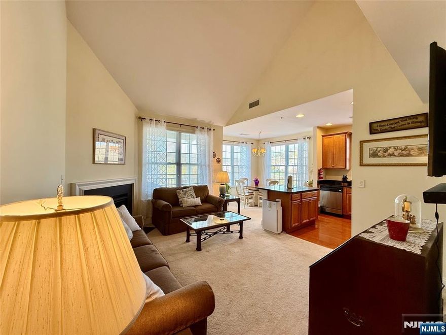 LIVE THE GRANDE LIFE! Best Location! Near clubhouse & pool. 1553 S.F elegance. Beautiful "Hickory Model" 4th flr 2 bedroom, 2 bath condo w/Loft. Cathedral ceiling! Private, quiet end unit. Peaceful views from all rooms. Featuring 2 bedrooms w/WIC in each bdrm. Two full baths! Kitchen w/ ctr island, granite, SS appliances, upgraded cabinets. Spacious LR w/gas FP. Separate dining area with plenty of windows and light. Spacious Loft which can be used as another bedroom, office or whatever your heart desires. Laundry rm accommodates full size W/D side by side! You will fall in love with this beauty! Amazing low Riverdale taxes. One car garage assigned parking space underneath bldg. Plus add'l parking. Experience the Grande life with a wealth of amenities, including 2 clubhouses equipped with fitness centers, billiards rooms, conference rooms, party rooms, tennis and basketball courts, 2 swimming pools, and much more! Enjoy a fantastic location with easy access to major highways, shopping, and restaurants. PET POLICY- MAX 2 PETS-35LB WEIGHT LIMIT PER PET.