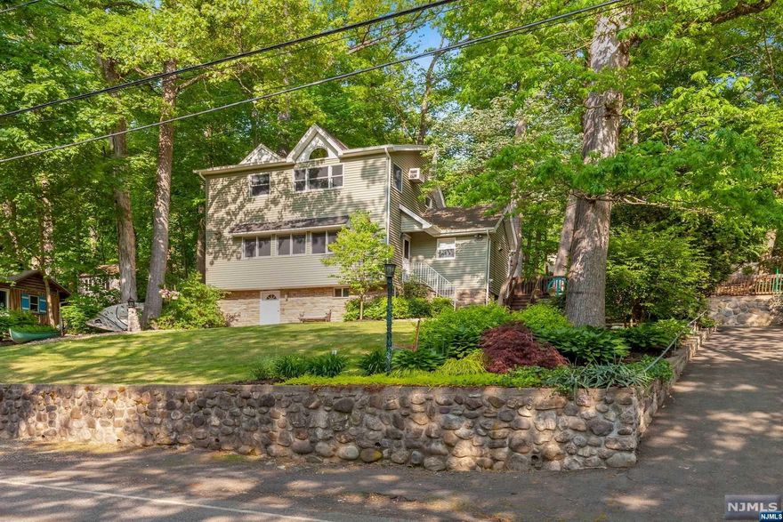 This lovely, renovated 3 bedroom, 2 bath home is 2,022 sq. ft., has views of Cupsaw Lake & plenty of space for indoor and outdoor living. Spacious loft overlooks the living room w/wood burning fireplace. Updated kitchen boasts maple cabinets, granite countertops & stainless steel appliances. Family room with sliding glass door leads to a large deck w/outdoor fireplace, nice yard, new fence & lake views. Driveway & off-street parking for 11 cars! Optional membership to Cupsaw Lake available to enjoy the LAKE LIFESTYLE at it's best w/a lovely beach & clubhouse, playground, plenty of clubs & activities. There is a lot to enjoy in this terrific lake community.