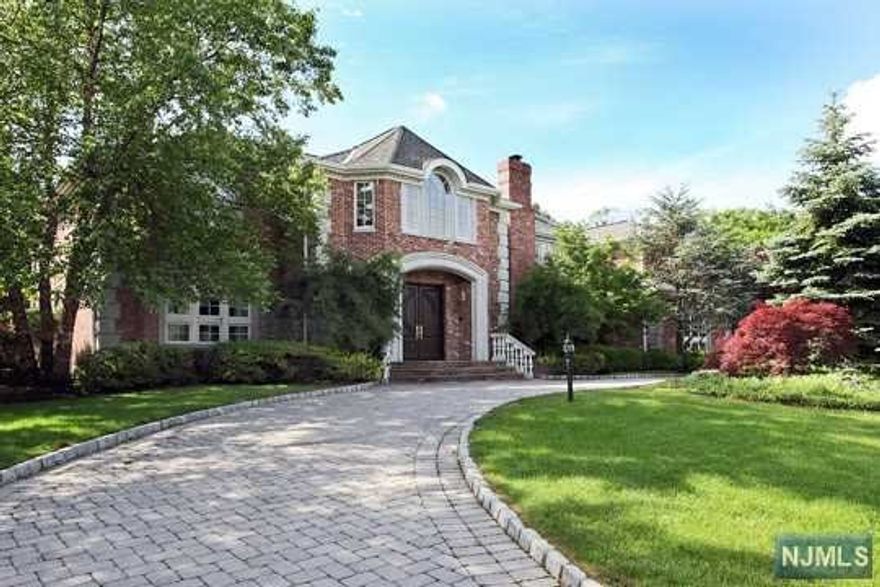 Set high on the cliffs in the desirable Tammybrook Hills section of Cresskill, The Perfect "COVID COMPOUND"! A beautiful six-bedroom, nine-bath resort-style center hall colonial with pool and tennis court. Drive up the circular paver driveway and admire the manicured grounds and long sunset views. The grand two-story foyer with marble flooring and bridal staircase welcomes you to the sunfilled home. With over 10,000 sq ft, the home features a modern open layout, ten-foot ceilings, large-scale rooms, and windows. The first level includes a mahogany library with doubled sided fireplace shared with the formal living room, a great room with a fireplace, a wet bar, and french doors leading to the backyard. The chef's kitchen includes a center island and breakfast area; it connects to the elegant formal dining room with a fireplace. The second level offers a generous master suite with a sitting area, walk-in closet, and spa-like bath. It includes three additional en-suites. The unique w