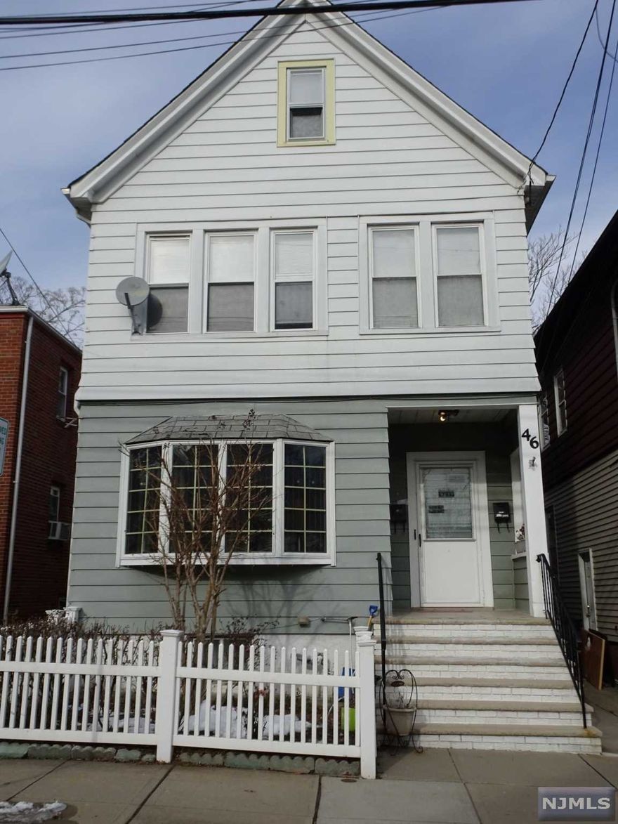 Large Two Family perfect for investment or live in and collect rent. Maintained by long time owner but sold "as Is" with no known issues. Owner's 1st floor apt offers Bright, Spacious Living Rm/Dining Rm combo, Updated Kit w Granite Ctrs has separate large dining area, 2 Bdrms, and Full Bath w floor to ceiling tiles. 2nd Floor Apt has same layout as 1st floor plus an Office. Walk Up attic w finished muti purpose room and plenty of room for storage can be further finished. Full finished basement with Rec Rm, Den, office and walkout. Separate heat, electric, and gas. Replaced windows, hardwood floors, Fenced-In Yard w paver patio and storage shed. Centrally located to highways and shops. Steps to school. A MUST SEE!