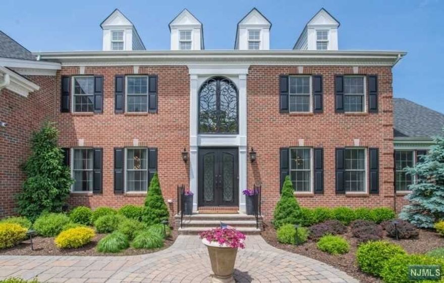 Welcome to perfection! Stately Colonial w over 5000 sqft boasts stunning refinement at every turn! Exquisitely renovated in 2019 to the highest standards. Meticulous attention to detail is evident thru out. Contemporary styling is mixed w inviting decor. Grand 2 Story entry brings you to chefs kitchen & BB w Silestone counters and waterfall breakfast bar. Unique butlers bar & 2 story FR w windows galore bringing in tons of natural sunlight! Expansive MB Suite with Sitting Room and 3 walk in closets beyond your wildest dreams! Top it off w a M/Bth bar none! Beautiful oversized Spa Shower & Sauna to relax in! W/O LL is a delight! Exercise rm & great room to spend quality time. Private yard includes beautiful deck, patio and firepit to enjoy all year! Go to docs for the full list of amazing features this home has to offer!