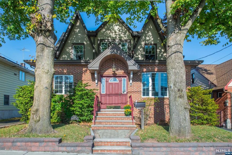 An instant ambiance of warmth is present with this classic Heights Colonial. Vision your style and decor effortlessly amongst the original trim woodwork, inlay wood flooring, and charming fireplaces. Main level offers a sun-filled entry with bonus Den/sitting area, large LR w/wood-burning fireplace, formal DR w/decorative fireplace, eat-in kitchen, home office, and powder room. Retreat upstairs to the primary Bedroom with walk-in closet, two additional Bedrooms, and main Bath. The finished basement offers a large recreation room, full Bath, laundry, and storage - ideal as extra office space, game/playroom, and/or for extended family and guests. Spotlight features include newer furnace, one car over-sized detached garage w/loft storage, walk-up Attic, and close proximity to Woodland Park, town center, schools, and NYC transportation. This home is ready for the perfect buyer wanting to savor this year's holiday memories and cozy winter nights by the fire.