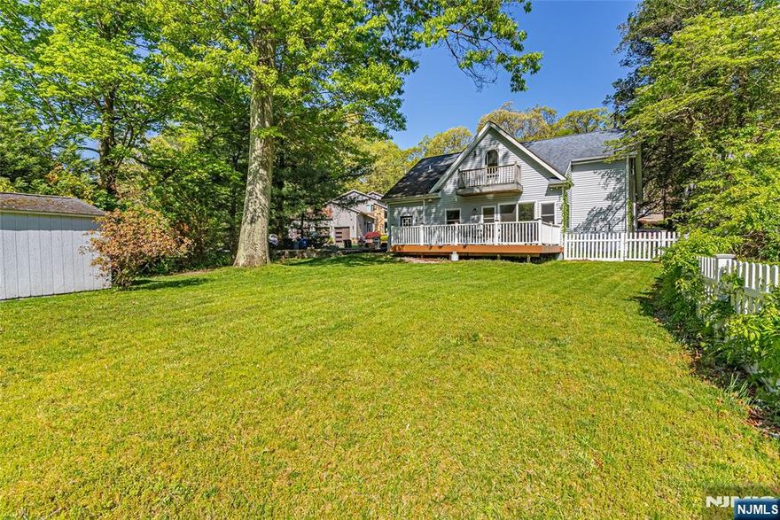 Charming Lake Community Rental in Cedar Lake " Denville, NJ! Available for move in May 1, this well maintained 3 bedroom, 2 full bath home is nestled on a quiet cul-de-sac just a short walk to Cedar Lake. The main level offers true one floor living with no stairs, featuring a bedroom and full bath, a spacious eat-in kitchen with hardwood floors, and a bright living room with sliders leading to a private back deck. perfect for relaxing or entertaining. Upstairs you'll find two additional bedrooms, including a primary bedroom overlooking the backyard with seasonal lake views, and an oversized full bath with a glass stall shower. Washer and dryer conveniently located on the upper level. Enjoy all the perks of Cedar Lake community living walking-distance beaches with lifeguards, boating, clubhouse events, playground, and ice skating in winter. Pets welcome with approval (town licensed, well trained cats and dogs considered). Located in highly desirable Denville Township, known for its top rated schools, vibrant downtown with shopping, dining, and year-round community events. Convenient to the library, hospital, sports fields, hiking trails, major highways, and NYC-direct train and bus service.A rare opportunity to enjoy lake community living in one of Morris County's most sought-after towns. (Photos are from previous listing prior to tenancy)