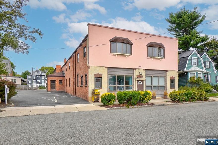 1 MONTH FREE RENT WITH 3 YEAR LEASE (minimum). The Livery Building is located in the heart of the Upper Montclair Business District with easy access to parking, post office, restaurants, & other business services. NYC train and bus just around the corner. With approximately 1780 sq ft, this 2nd fl space - Suite 12 - offers four offices, an open work area and a reception area. Beautiful exposed antique brick, large windows and central air complement the working space. 2 assigned parking spaces in private lot and plenty of on-street parking.