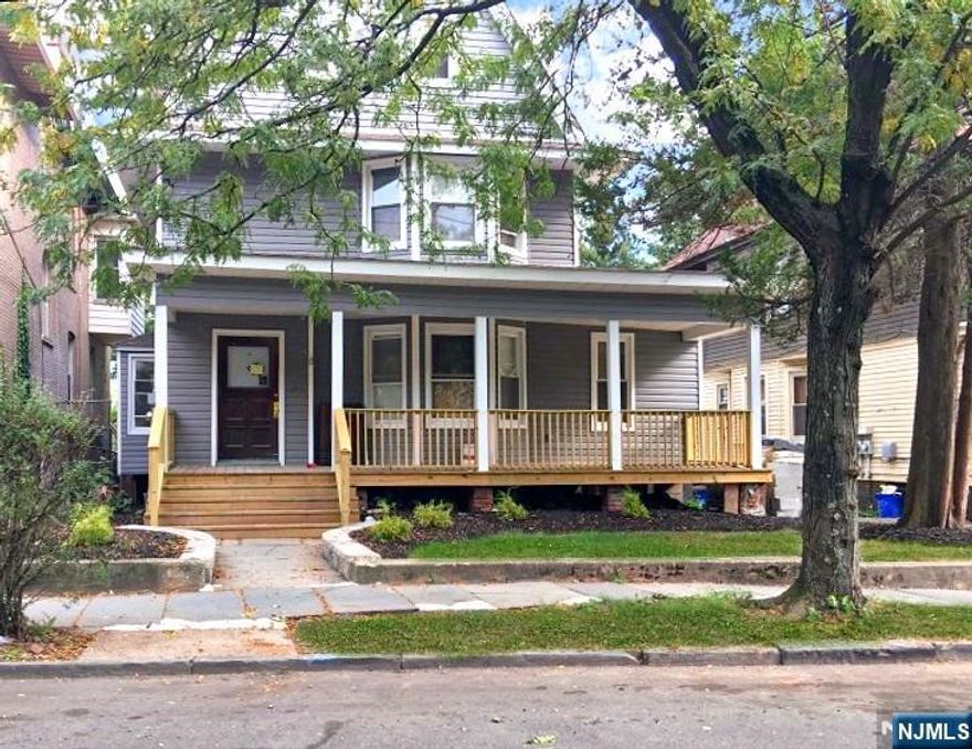 Welcome to this exceptional legal three-family home a rare opportunity offering both comfortable living and outstanding investment potential. Pride of ownership shines throughout this meticulously maintained property, featuring a 6-car backyard parking area and a picturesque gazebo with sweeping views of the New York City skyline, creating the perfect ambiance for relaxing or entertaining. A potential bonus basement unit adds even more value and flexibility. Each unit is thoughtfully designed and in excellent condition, offering large eat-in kitchens, spacious living and dining areas, generous bedrooms, and abundant storage delivering comfort, functionality, and lasting appeal for residents. Ideally located within walking distance to schools, restaurants, shopping, and everyday conveniences, this home provides the lifestyle today's buyers seek. The property will be delivered with two vacant units, including the largest, creating an ideal opportunity to live in one unit while generating rental income, or to maximize returns as a fully income-producing asset. Enjoy an exceptional commuter convenience just minutes from Newark Liberty International Airport via the Route 78 corridor and close to Newark Penn Station with direct Midtown service to Manhattan.