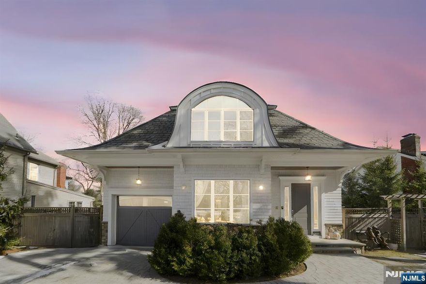 Step into a world of luxury and sophistication in this contemporary masterpiece. The grand foyer, with its soaring 10-foot ceiling, welcomes you with natural light dancing across stunning herringbone floors. The first level features a spacious great room with a cozy fireplace, a versatile bedroom or home office, a gourmet kitchen adorned with exquisite Downsview cabinetry, a family room, and a formal dining area. Upstairs, youâ€™ll find four en suite bedrooms, including a lavish primary suite with a dressing area and spa-like bath, along with a conveniently located laundry room. The lower level is a bright and expansive retreat, boasting 10-foot ceilings, a recreation room, and an indulgent at-home spa complete with a sauna and shower. Every detail has been thoughtfully curated, with modern conveniences such as a security system and central vacuum enhancing your living experience. Nestled in the sought-after East Hill neighborhood, Top-rated schools, NYC transportation,