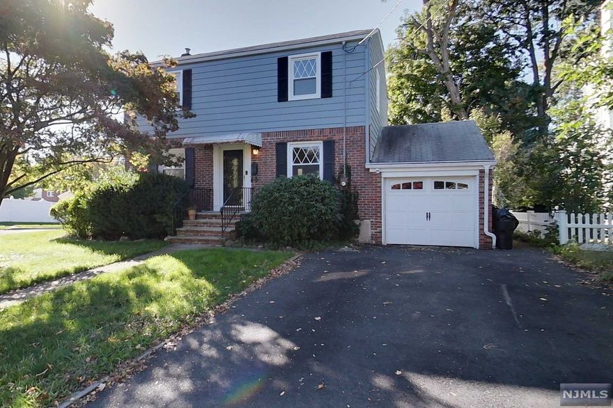 This 3 bedroom 1 and a half bath center colonial home is in a very desirable location of Dumont. It is close to schools, parks, shopping, and transportation to NYC. This property has a bonus enclosed porch in the rear of the house along with a sizable shed in the fenced in backyard. There is an attached 1 car garage with a driveway that can hold up to 4 additional cars. The first floor has a living room, dining room, and kitchen. The second floor has 3 bedrooms and a bathroom. Pergola is not included. House being sold as is.