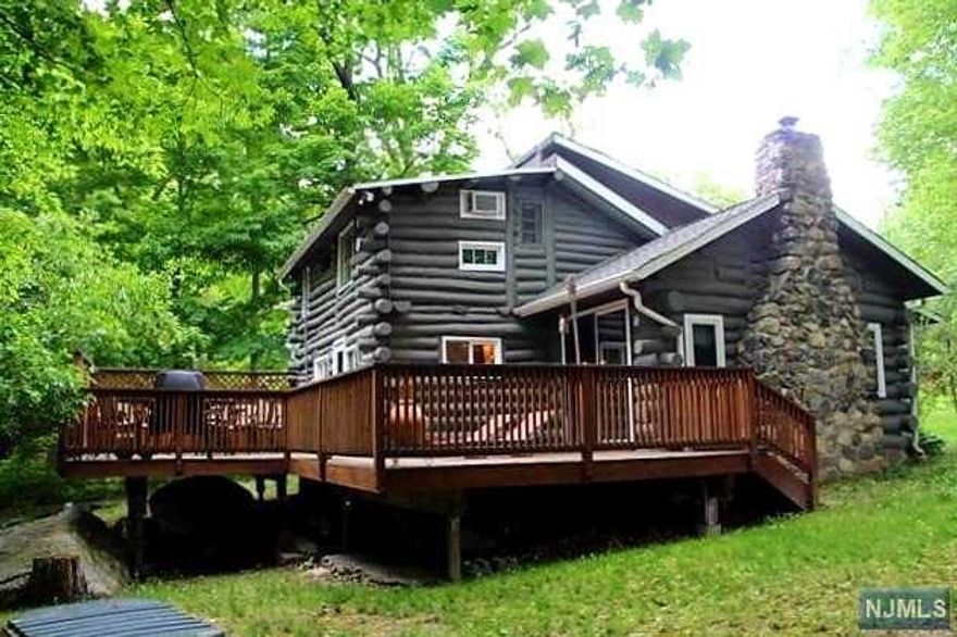 This open floor pln charmer is EZ to fall in love with! Large private deck with wooded western views and sounds of babbling brook are enticing in all seasons! The vaulted beamed ceilings, woodstove set in the stone fireplace for cozy evenings, sliders to deck for EZ entertaining and large open living/dining give you a instant feeling of home. Living area features a large bay window for plenty of morning light. Original wood floors and beamed, T&G ceilings add that extra warmth. Primary BR on main level with 2 additional rooms on loft level offer plenty of sleeping areas. Sunny EIK with access to deck BBQ only steps away. The 9x18 bonus rm offers laundry, outdoor access and plenty of room for all your storage needs. 2 storage sheds, one with elec complete your outdoor storage needs. And then there is the generator hookup for that added security. Recreation opportunities abound with lakes, hiking, skiing, biking, antiquing, golf, wineries, orchards, festivals, quaint towns, etc