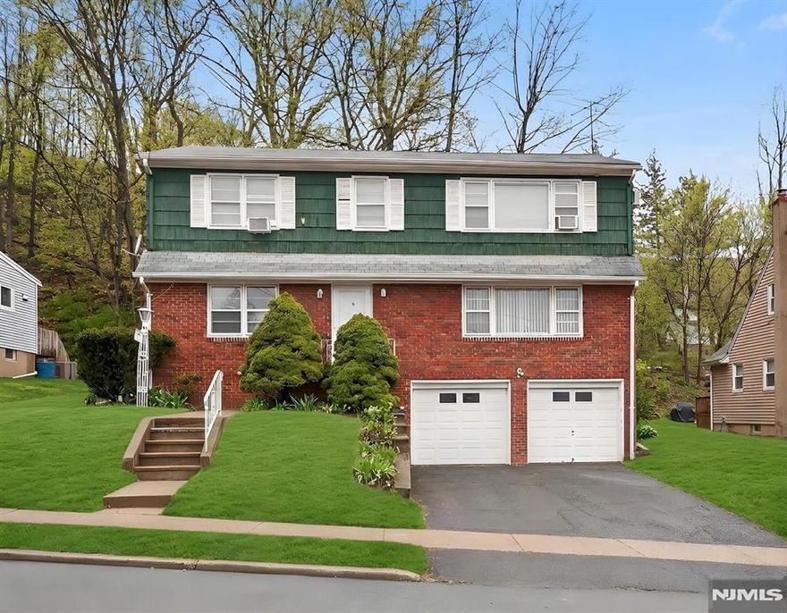 Fantastic opportunity for homeowners and investors alike! This well-maintained two-family home offers generous living space, separate utilities, and a convenient location close to everything Hawthorne has to offer. The first floor unit features approximately 1,600 sq ft of living space with 3 spacious bedrooms and 2 full bathrooms. The layout includes large, sun-filled rooms, a comfortable living room, a formal dining room or versatile bonus space, and a large eat-in kitchen perfect for everyday living and entertaining. This unit also includes central air conditioning for year-round comfort. The second floor unit offers approximately 1,000 sq ft with 2 bedrooms and 1 full bathroom, along with beautiful hardwood floors and views of the NYC skyline. Additional highlights include a full unfinished basement with two washer and dryer hookups, separate utilities for each unit, and a 2-car garage providing ample storage and parking. Ideally located close to schools, parks, shopping, restaurants, and public transportation, making commuting and daily errands a breeze. Don't miss this excellent opportunity in the heart of Hawthorne!