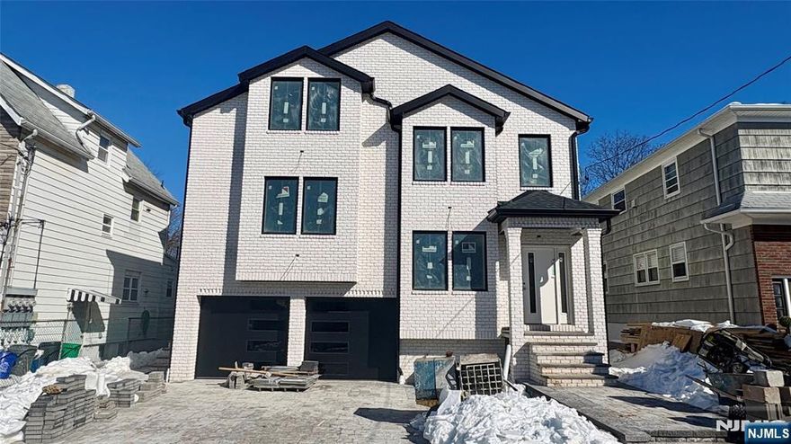 BRAND NEW 2-family construction with approx. 4,300 sqft. Modern open-concept layout with large windows for natural light and a nice-sized deck. 1st Fl combined with ground floor with a total of 4 bedrooms, 3 full baths, and 2 half bathrooms. Second Fl offers 3 spacious bedrooms, 2 bathrooms with an ensuite bathroom, and laundry in the unit. Stainless steel appliances, quartz countertops, and hardwood floors throughout. Central heating and cooling. Attached 2-car garage with paved driveway. Centrally located with easy access to public transportation, local shops, and a quick commute to the CITY. Ideal for investors or owner-occupants. 10 years warranty!