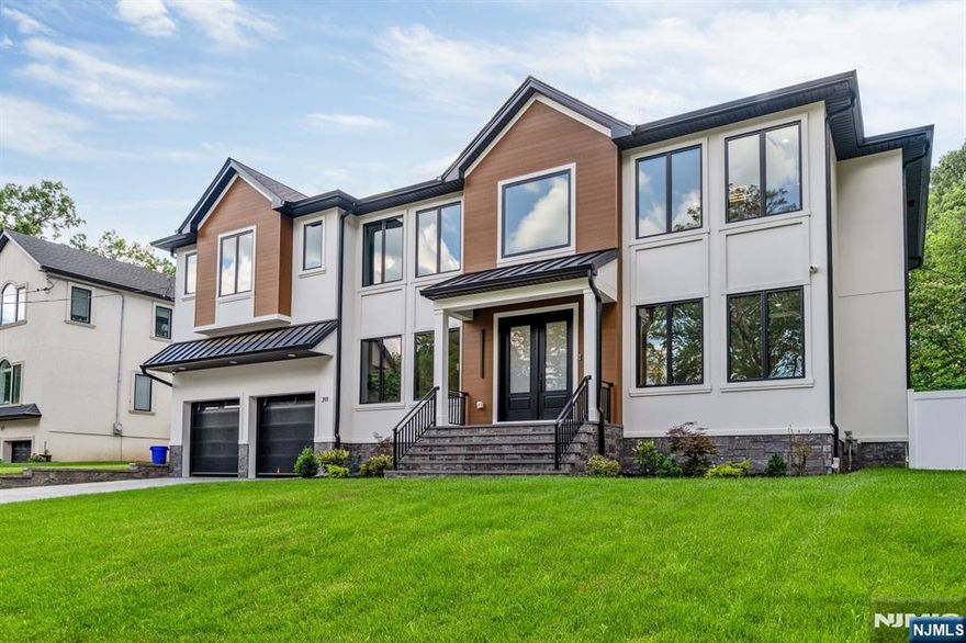 Absolutely stunning new construction masterpiece just completed in the heart of Paramus by a highly reputable local builder. This luxurious home offers over 7,500 sq ft of thoughtfully designed living space across three levels, featuring 6 bedrooms and 6.5 bathrooms. A grand two-story foyer welcomes you into elegant formal living and dining rooms, leading into a spacious great room that flows seamlessly into the open-concept chefâ€™s kitchen, fully equipped with premium Sub-Zero, Wolf, and XO appliances, a dry bar, and large center island. The main level also includes a private guest suite with en-suite bath and a stylish powder room. Upstairs, find four spacious bedroom suites each with its own full bath and custom California closets along with a convenient laundry room, all bathrooms on this level are equipped with heated floors. The primary suite is a true retreat, featuring two oversized custom walk-in closets, a spa-like bathroom, and a private dry bar. The fully finished basement is built for entertaining, complete with a home theater, gym, sixth bedroom and full bath, and a large rec room with a wet bar. Additional highlights include aguathin water pure system, central vacuum, outdoor surveillance cameras, and a full irrigation sprinkler system. A rare blend of timeless elegance and modern luxury, this exceptional residence is perfectly located in one of Paramusâ€™ most desirable neighborhoods.