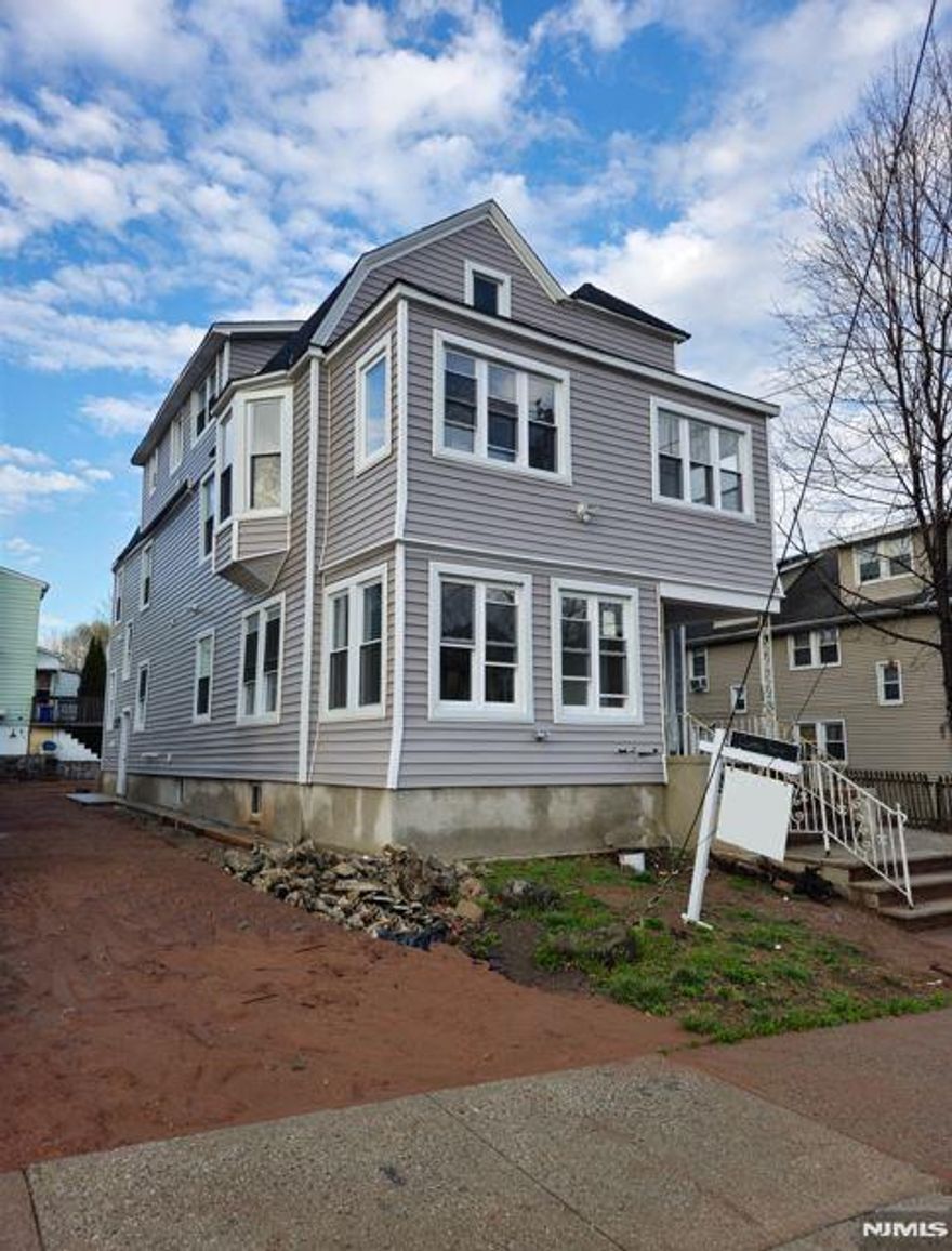 Welcome to this massive, brand-new 2-family home, fully gutted to the studs and rebuilt with top-of-the-line upgrades, sits in a legal 3-family zone on a double lot with a new driveway. Spanning four finished levels, the first-floor unit offers 2 bedrooms, 3 baths, a living room, dining room, kitchen, family room, laundry, and mechanical room. The second-floor unit features 3 bedrooms, 3 baths, a living room, dining room, kitchen, family room, and laundry room. Every detail has been completely redone, including new plumbing, electrical, insulation, framing, roof, siding, windows, and HVAC, with separate utilities and HVAC systems for efficiency. Located near public transportation and major highways, commuting is easy. With modern upgrades, spacious interiors, and high-end finishes, this home is a rare opportunity. Don't miss out on this move-in-ready gemâ€”schedule your showing today!